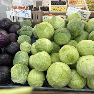 a display of cabbages and other vegetables