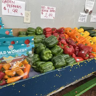 a display of peppers and other vegetables