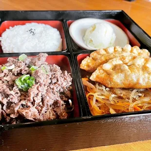 a bento box of food