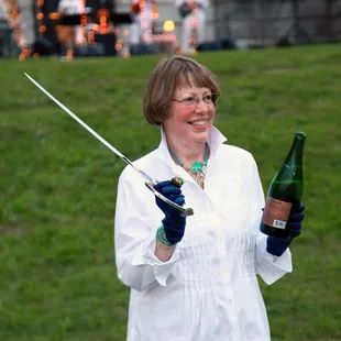 Ms. Kish sabering champagne!