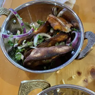 "Over baked" potatoes. They were just reheated and half burned.