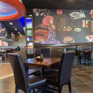 a dining area with tables and chairs