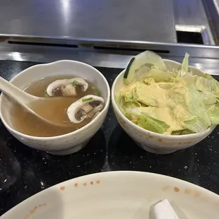Soup and salad that come with hibachi dinners