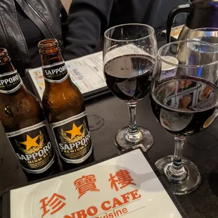 Sapporo for $4.75 each and Merlot wine for $4.50 each.