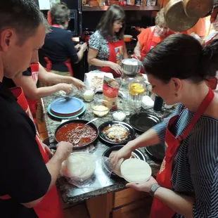 Making red chile beef enchiladas.