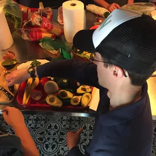 Taco team building, making guacamole.
