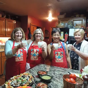 Perfect Margaritas with freshly made salsas and composed nachos in foreground.