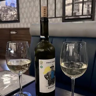 a bottle of wine and two glasses of wine