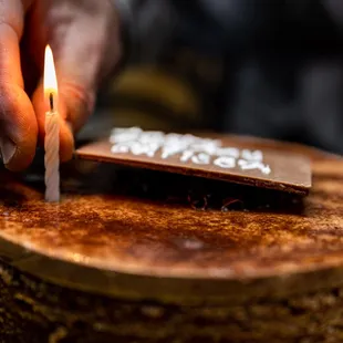 Chocolate Decadent Cake ($54) thin layers of chocolate cake and raspberry jam topped with chocolate ganache, shavings and mirror glaze