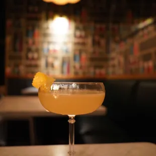 a closeup of a cocktail in a coupe glass