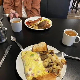 a plate of food and a cup of coffee
