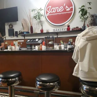 Super cute diner, love the plants all around.