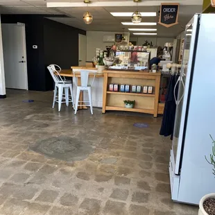 a kitchen with a table and chairs