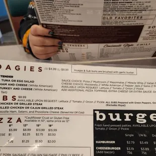 a person holding a menu