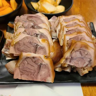 a plate of sliced pork