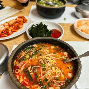a person eating a bowl of soup