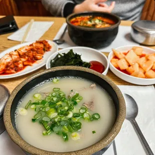 a bowl of soup and bowls of food