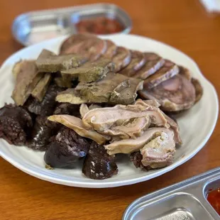 a plate of meat and vegetables