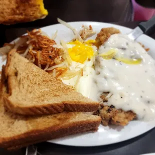 Hand breaded chicken fried steak and eggs