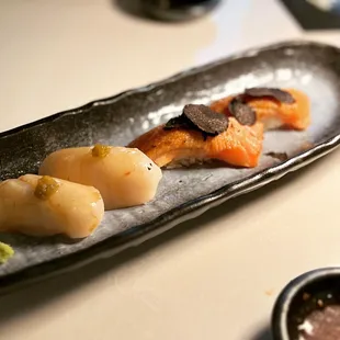 nigiri sushi, including one with truffles on top