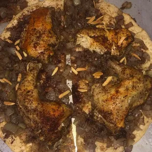 Msaghan!  Onions dipped in olive oil, and spread on Taboon bread. Served with a piece of chicken of your choosing.
