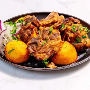 Lamb Kuurdak -
Stewed lamb with potatoes and onions served in a hot plate