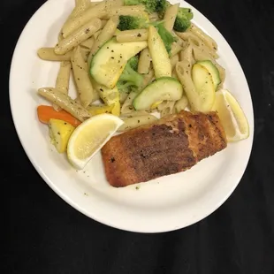 Grilled salmon with penne veggies and garlic butter