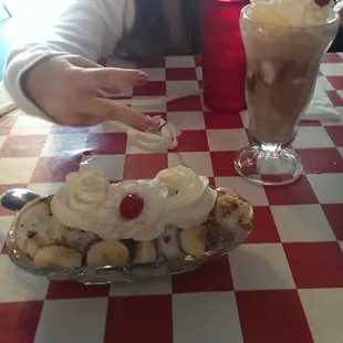 My daughter being ridiculous with a Saturday Night Special and a Chocolate Ice Cream Soda.
