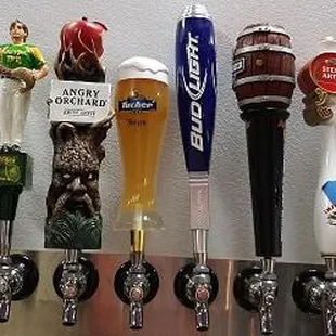 a row of beer taps