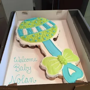 Baby shower &apos;cupcake&apos; cake.