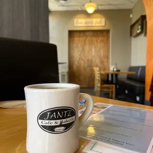 a coffee cup on a table