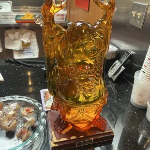 a glass statue of a buddha