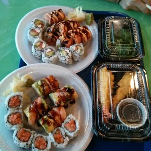 Assortment of special rolls, shrimp tempura, and seaweed salad
