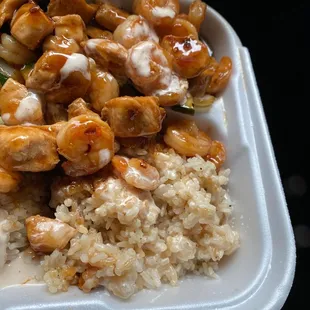 chicken and rice in a styrofoam container