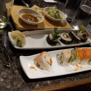 a variety of sushi dishes on a table