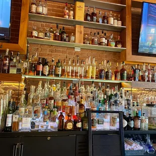 a bar filled with bottles of liquor