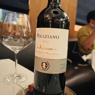 a bottle of wine and a glass of wine