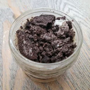 a close up of a chocolate cookie in a jar