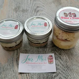 three jars of food sitting on a table