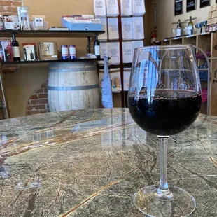 a glass of wine on a table