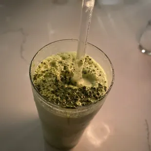a smoothie in a glass with a straw