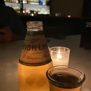 a shot of a beer and a shot of a beverage