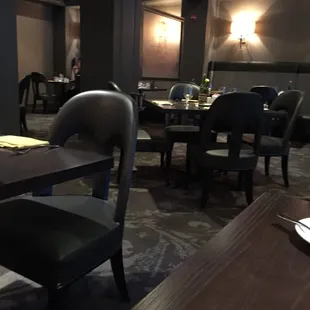 a dining room with tables and chairs