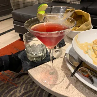 a glass of wine and a plate of food