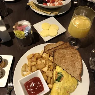 a plate of breakfast food on a table