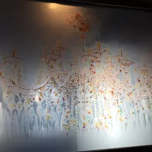 Artwork separating the dining room from the lobby area