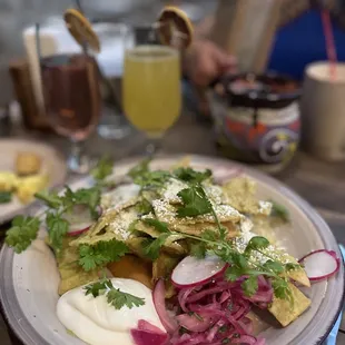 Green chilaquiles. So tasty! The beans are buried underneath so you can see them but they were also very good