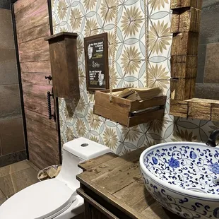 Cute bathroom. Has a changing table.