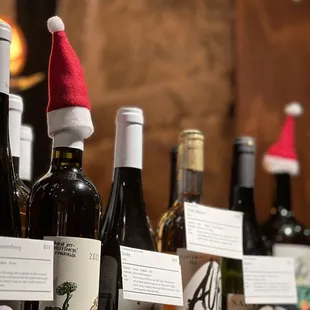 a row of wine bottles with labels on them