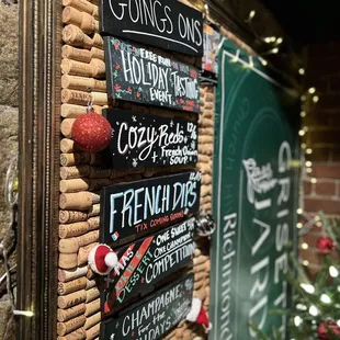 a cork board with christmas decorations on it